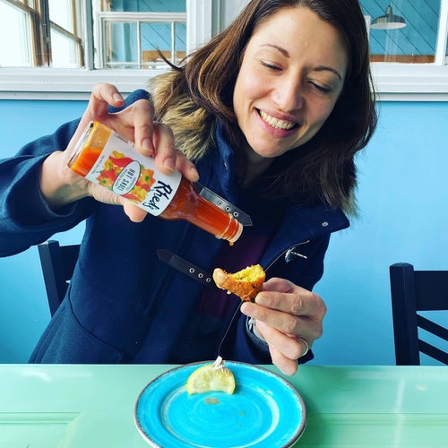 Owner Deja Hart of Rheds hot sauce