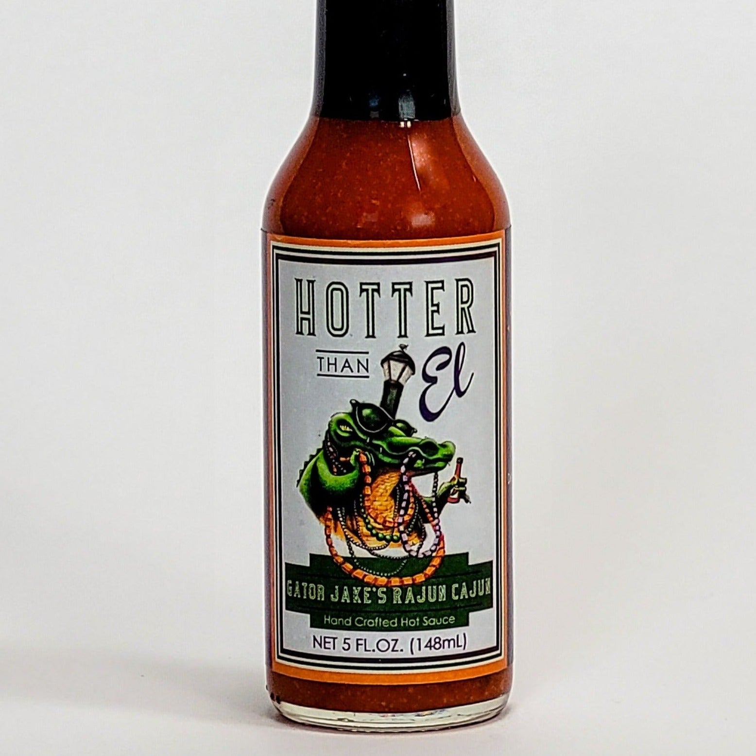 hotter than el gator jake's rajun cajun hot sauce label